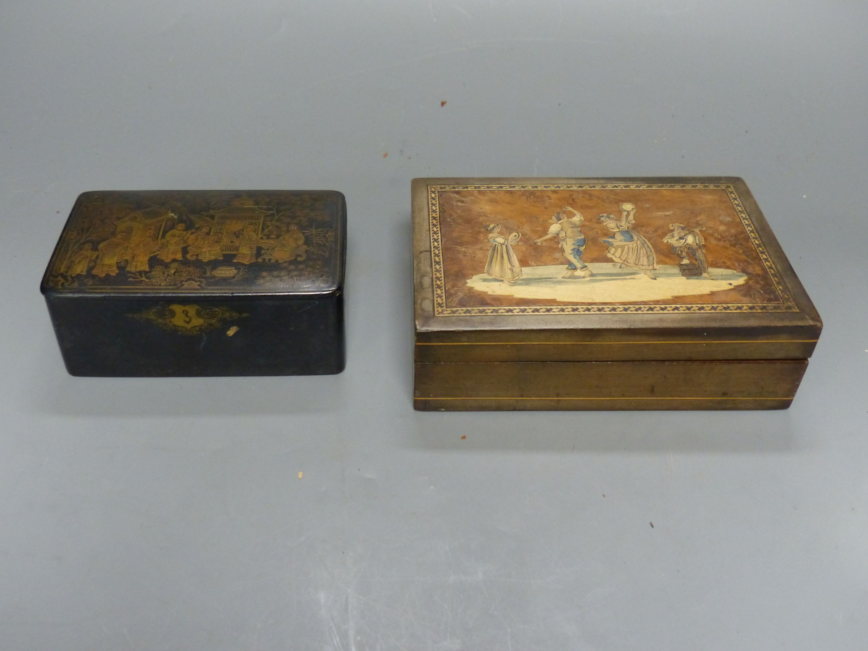A mother of pearl inlaid lacquer writing box, two smaller boxes and a circular tray